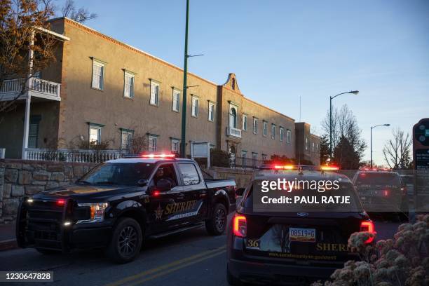 Sheriff's vehicles are pictured at a road block at the New Mexico Capitol in Santa Fe, New Mexico on January 17 during a nationwide protest called by...
