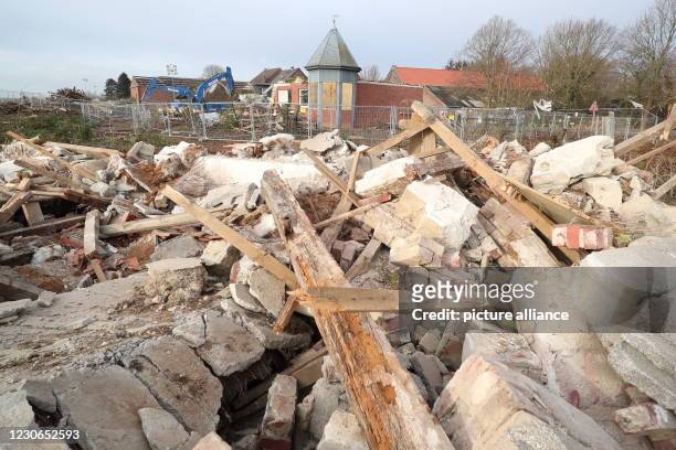 January 2021, North Rhine-Westphalia, Erkelenz: In Lützerath, excavators have begun demolishing former residential buildings, and construction debris...