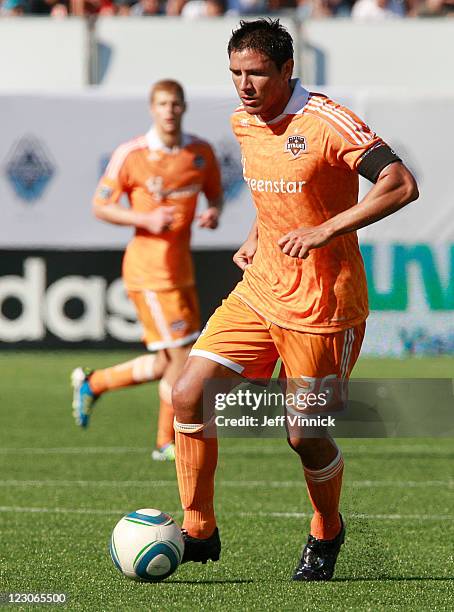 Brian Ching of the Houston Dynamo dribbles the ball upfield during their MLS game against the Vancouver Whitecaps FC August 27, 2011 at Empire Field...
