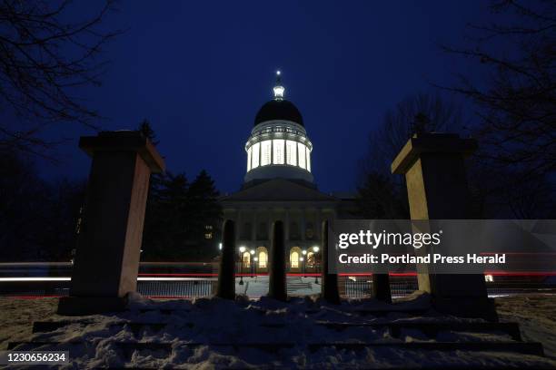 The Capitol Rotunda at the Maine State House is illuminated at dusk on Monday. Is security adequate for any upcoming protests like the one seen at...