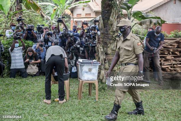 Bobi Wine, the musician and presidential candidate whose real name is Robert Kyagulanyi, votes in Magere, on the outskirts of Kampala during the...