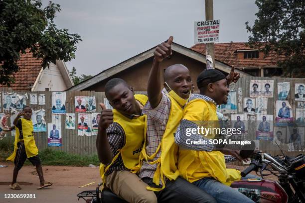 Supporters of Uganda's ruling National Resistance Movement party drive around Kampala on boda bodas following the announcement that Yoweri Museveni...