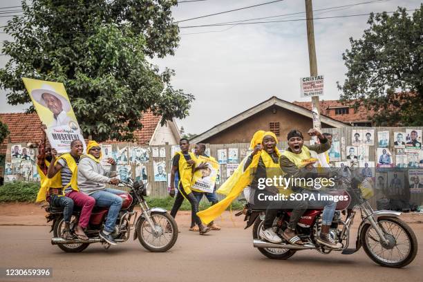 Supporters of Uganda's ruling National Resistance Movement party drive around Kampala on boda bodas following the announcement that Yoweri Museveni...