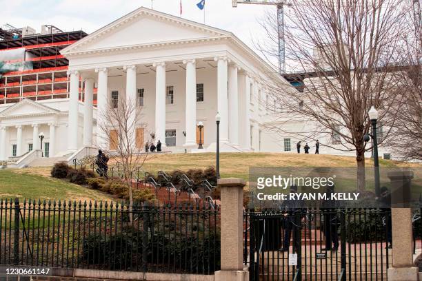 Police monitor a gun rights rally outside the Capitol in Richmond, Virginia on January 18, 2021. - Pro-Trump protests planned at state capitols...