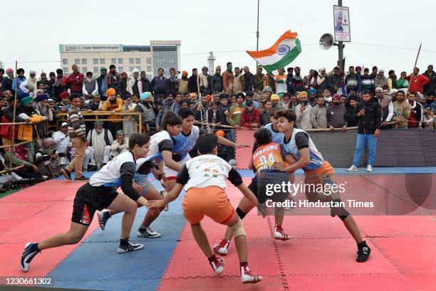 All women kabaddi teams play a friendly match during the ongoing protest against the new farm laws, at the Ghazipur on January 18, 2021 near New...