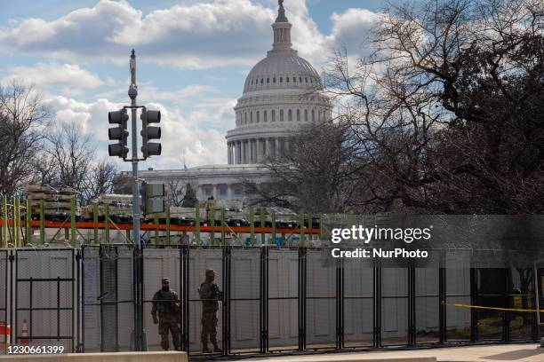 The US Capitol Building is seen behind barbed wire as security tightens ahead of presidential inaugural events in Washington, D.C. January 18, 2021.