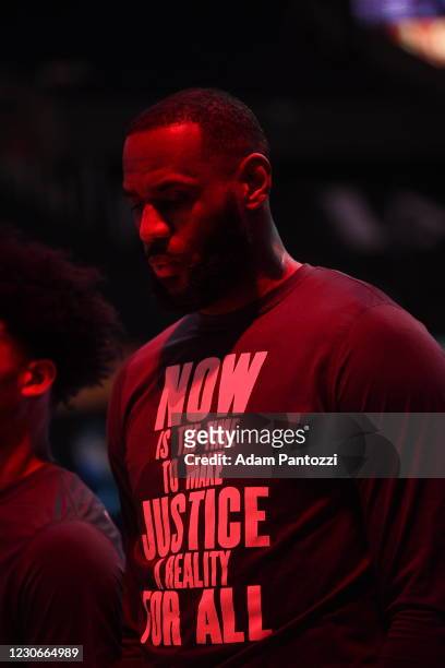 LeBron James of the Los Angeles Lakers stand for the National Anthem prior to a game against the Golden State Warriors on January 18, 2021 at STAPLES...