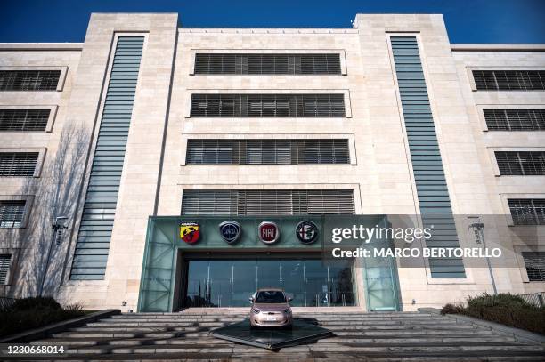 Picture taken on January 19, 2021 shows the logos of automobile companies Abarth, Lancia, Fiat, Alfa Romeo and Jeep and a newly-added board with the...