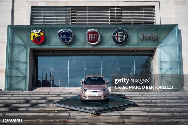 Picture taken on January 19, 2021 shows the logos of automobile companies Abarth, Lancia, Fiat, Alfa Romeo and Jeep and a newly-added board with the...