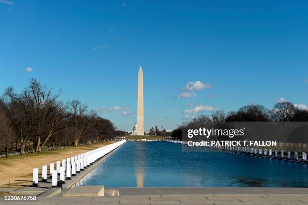 Memorial to victims of Covid-19 is seen at the Lincoln Memorial pool on January 19, 2021 in Washington, DC, on the eve of the 59th presidential...