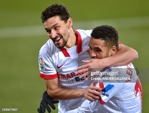 Sevilla's Moroccan forward Youssef En-Nesyri celebrates with teammate Spanish midfielder Jesus Navas after scoring a goal during the Spanish league...