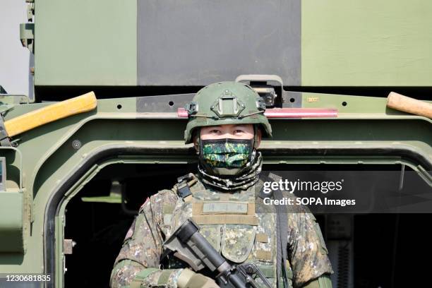 Taiwanese soldier stands on guard at the Hukou military base during the military exercise ahead of next months Lunar New Year. Taiwan staged a...