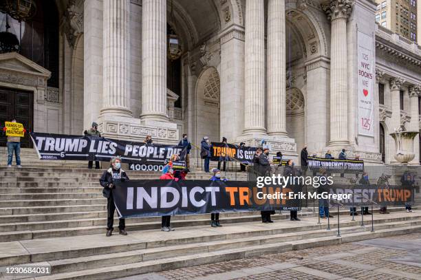 Participants seen holding banners at the reading of impeachable crimes attributed to Trump. On January 19, 2021 members of the activist group Rise...