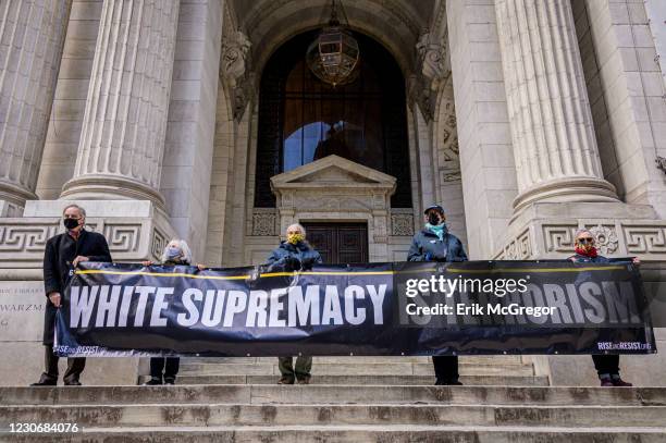 Participants seen holding a banner at the reading of impeachable crimes attributed to Trump. On January 19, 2021 members of the activist group Rise...