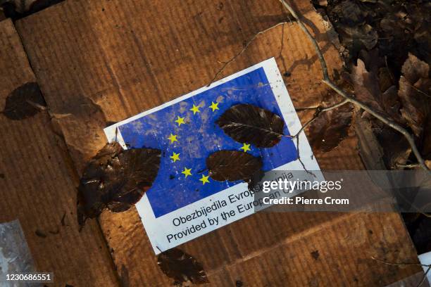 Box of aid provided by the European Union is seen in a makeshift camp where 70 migrants and refugees from Bangladesh live in harsh conditions on...