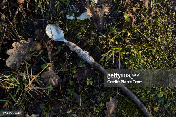 Spoon is seen in a makeshift camp where 70 migrants and refugees from Bangladesh live in harsh conditions on January 6, 2021 in Velika Kladusa,...