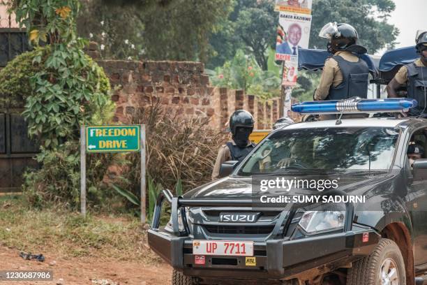 Patrol car of the Ugandan police is seen stationed outside the compound of Ugandan opposition leader Bobi WIne on January 20, 2021. - Uganda's...