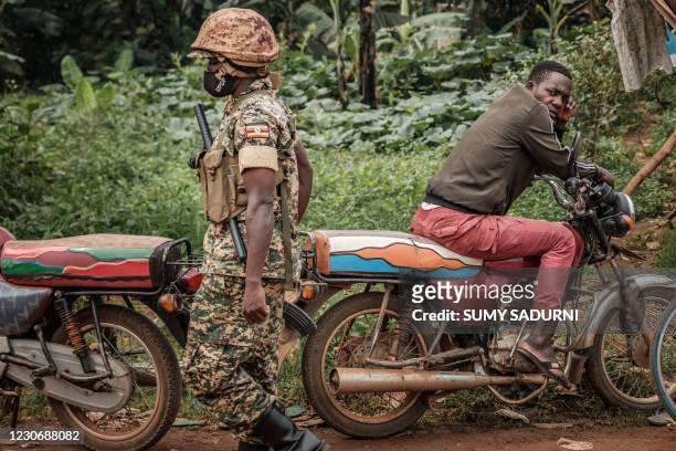 Patrol car of the Ugandan police is seen stationed outside the compound of Ugandan opposition leader Bobi WIne on January 20, 2021.. - Uganda's...