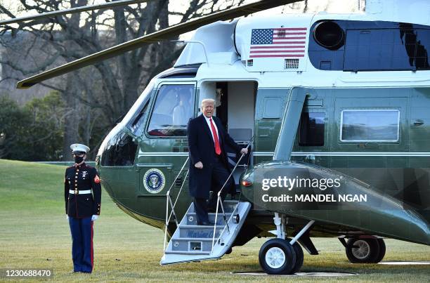 President Donald Trump boards Marine One as he departs the White House in Washington, DC, on January 20, 2021. - President Trump travels to his...