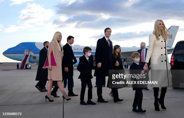 Ivanka Trump , husband Jared Kushner , their children, Eric and Donald Jr. , Tiffany Trump and Trump family members stand on the tarmac at Joint Base...