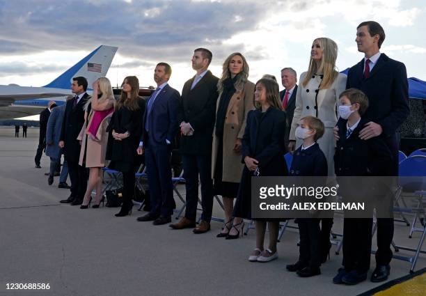 Ivanka Trump , husband Jared Kushner , their children, Eric and Donald Jr. And Trump family members stand on the tarmac at Joint Base Andrews in...