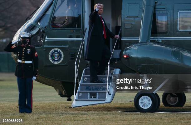 President Donald Trump and first lady Melania Trump board Marine One as they depart the White House on January 20, 2021 in Washington, DC. President...