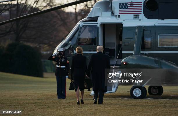 President Donald Trump and first lady Melania Trump prepare to depart the White House on Marine One on January 20, 2021 in Washington, DC. Trump is...