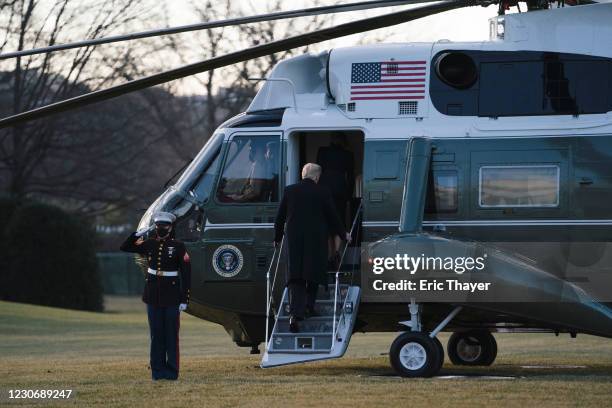 President Donald Trump and first lady Melania Trump board Marine One as they depart the White House on January 20, 2021 in Washington, DC. President...