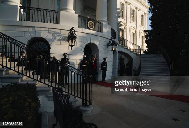 President Donald Trump and first lady Melania Trump prepare to depart the White House on January 20, 2021 in Washington, DC. Trump is making his...