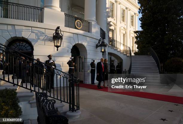 President Donald Trump and first lady Melania Trump prepare to depart the White House on January 20, 2021 in Washington, DC. Trump is making his...