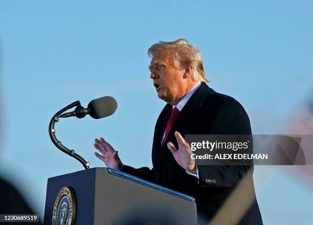 Outgoing US President Donald Trump addresses guests at Joint Base Andrews in Maryland on January 20, 2021. - President Trump and the First Lady...