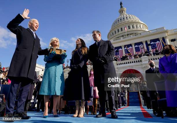 Joe Biden is sworn in as the 46th president of the United States by Chief Justice John Roberts, as Jill Biden and their children Ashley and Hunter...
