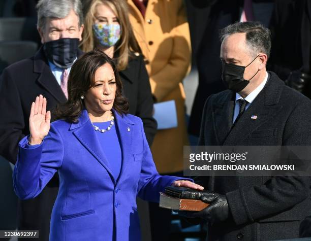 Kamala Harris, flanked by husband Doug Emhoff, is sworn in as the 49th US Vice President by Supreme Court Justice Sonia Sotomayor on January 20 at...
