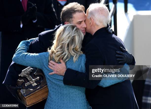 President Joe Biden and first lady Jill Biden hug Hunter Biden after being sworn in as US president during his inauguration on the West Front of the...