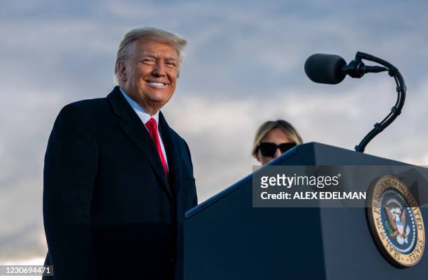 Outgoing US President Donald Trump and First Lady Melania Trump address guests at Joint Base Andrews in Maryland on January 20, 2021. - President...