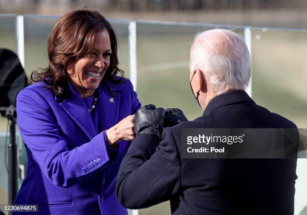 Vice President Kamala Harris fist bumps President-elect Joe Biden after she was sworn in at their inauguration on the West Front of the U.S. Capitol...