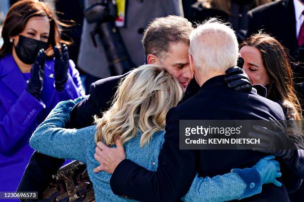President Joe Biden is comforted by his son Hunter Biden and First Lady Jill Biden after being sworn in during the 59th presidential inauguration in...