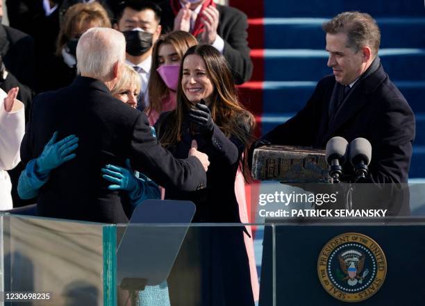 President Joe Biden is congratulated by First lady Jill Biden and children Ashley and Hunter after being sworn-in during the 59th Presidential...