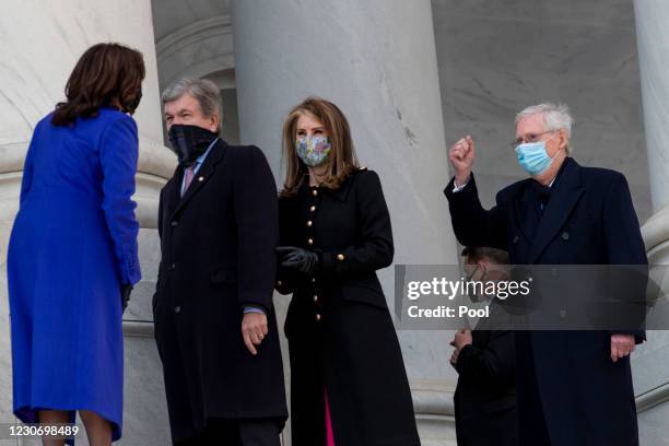 Vice President Kamala Harris, left, chats with United States Senator Roy Blunt , second from left, his wife Abigail Perlman Blunt, second from right,...