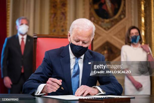 President Joe Biden signs three documents including an Inauguration declaration, cabinet nominations and sub-cabinet noinations in the Presidents...