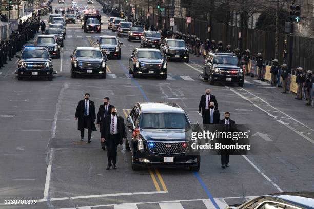 President Joe Biden and First Lady Jill Biden ride in the presidential limousine during the 59th presidential inauguration parade in Washington,...