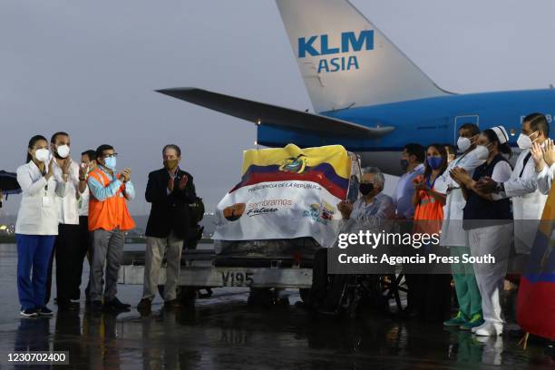 President of Ecuador, Lenín Moreno applauds after receiving the shipment with the first doses of the Pfizer-BioNTech Covid-19 vaccine at Jose Joaquin...