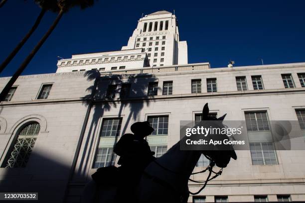 Police officer in a horse patrol stands in front of the Los Angeles City Hall on January 20, 2021 in Los Angeles, California. During today's...