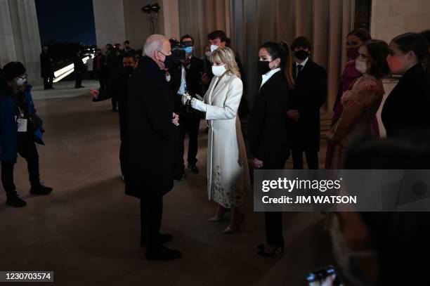 President Joe Biden stands with First Lady Jill Biden, daughter Ashley and grandchildren as he prepares to speak during the "Celebrating America"...