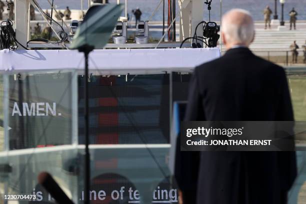 Words from US President Joe Biden's speech are seen on a teleprompter as he speaks after being sworn in as the 46th President of the United States on...