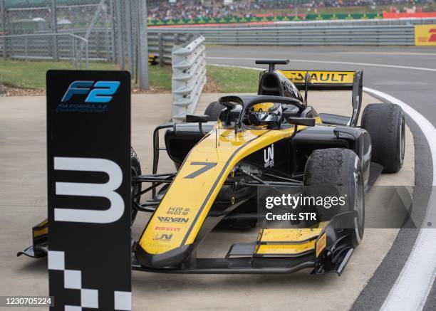 This photo taken on July 13, 2019 shows Chinese driver Zhou Guanyu returning to the pit after a feature race during the seventh round of the 2019 FIA...