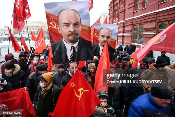 Russian Communist Party supporters walk towards the mausoleum of Russian communist revolutionary Vladimir Ilyich Ulyanov, also known as Lenin, to...