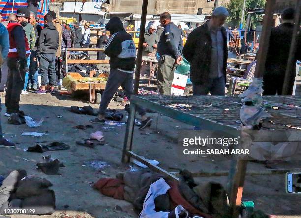 Picture shows the scene of a twin suicide bombing on a bustling commercial street in the heart of Baghdad on January 21, 2021. - The toll in a twin...