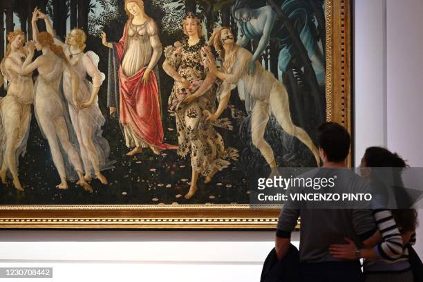 Visitors view Sandro Botticelli's "Primavera" at the Uffizi Galleries Museum on January 21, 2021 in Florence, Tuscany. - The Uffizi Galleries in...
