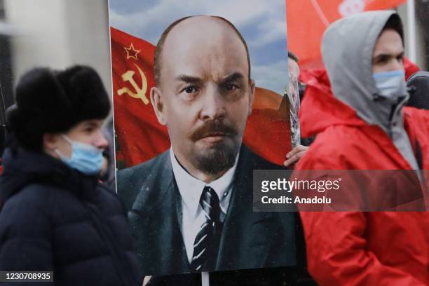 Communist Party members attend a commemoration ceremony to mark the 97th death anniversary of Vladimir Lenin at the Mausoleum of Vladimir Lenin at...